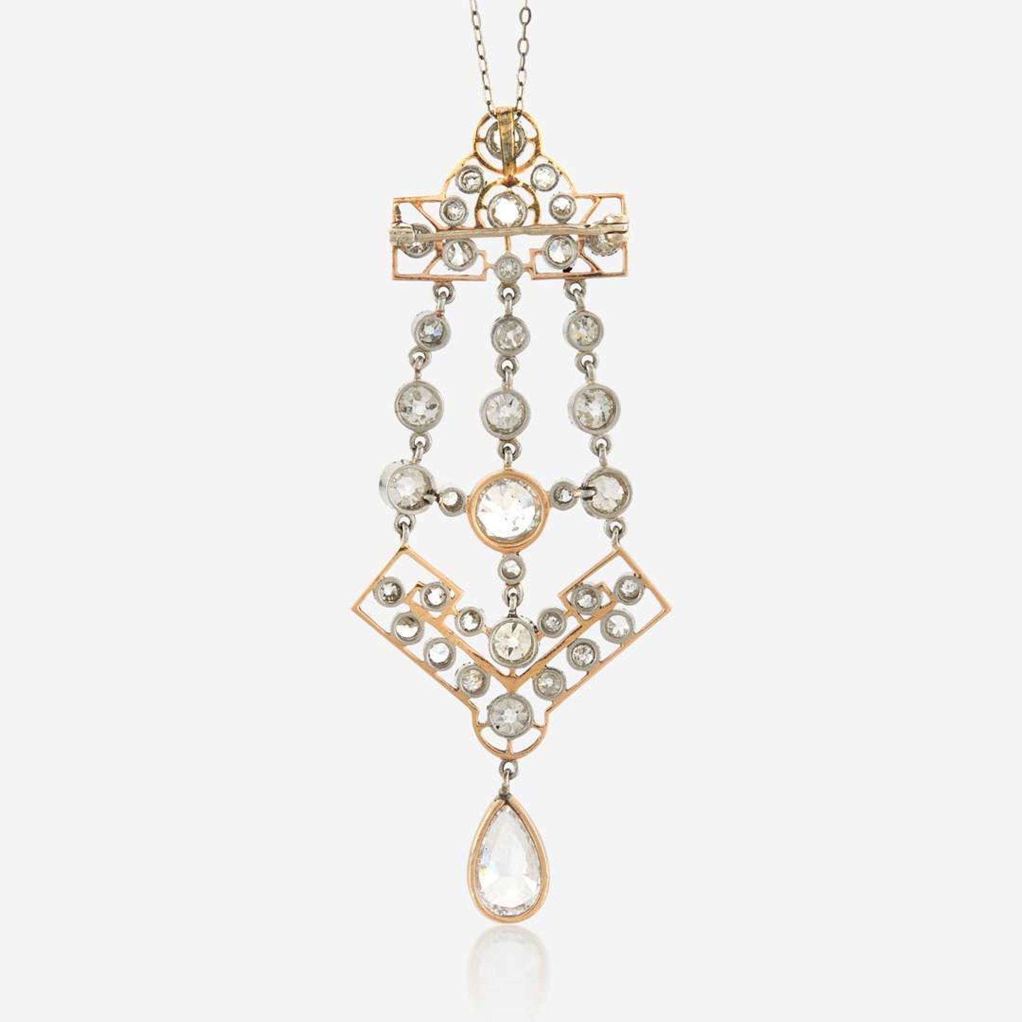 A diamond and platinum topped gold pendant