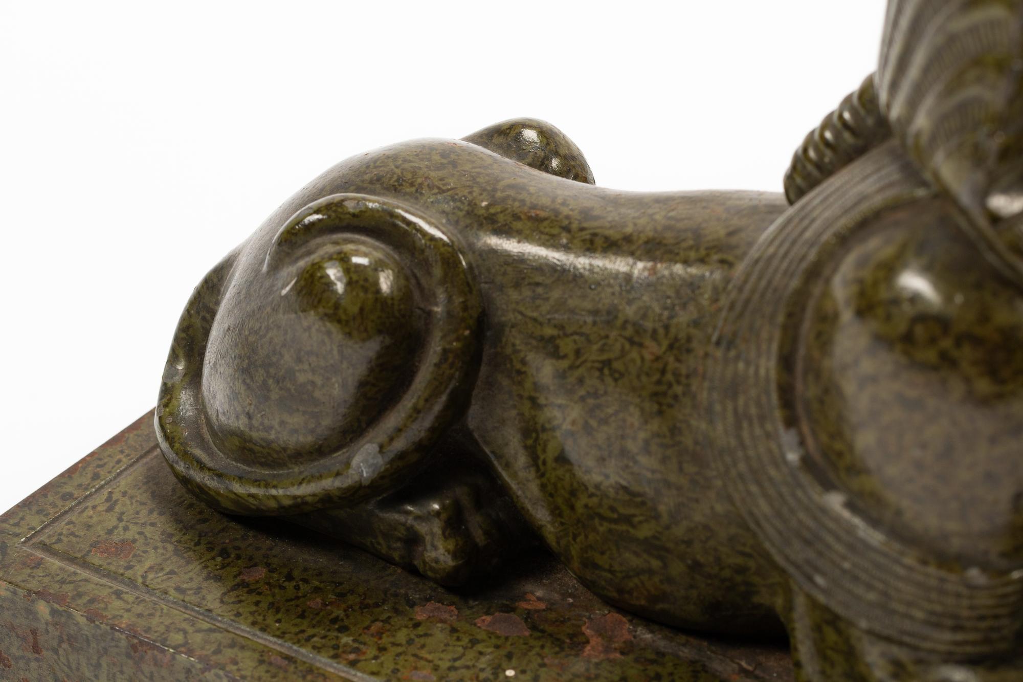 A Pair of Continental Patinated Metal Sphinxes
