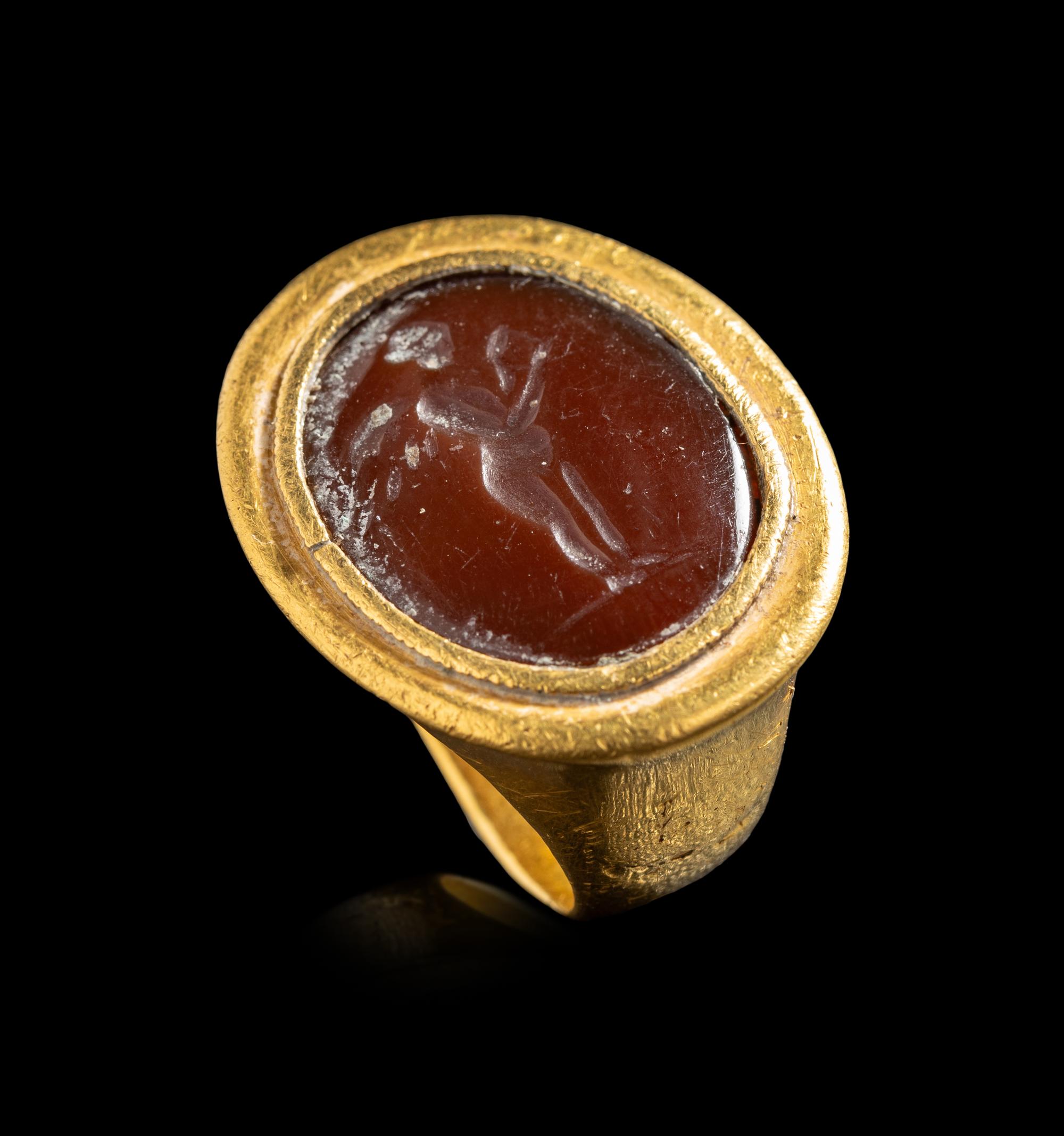 A Hellenistic Gold and Sard Finger Ring with the God Eros