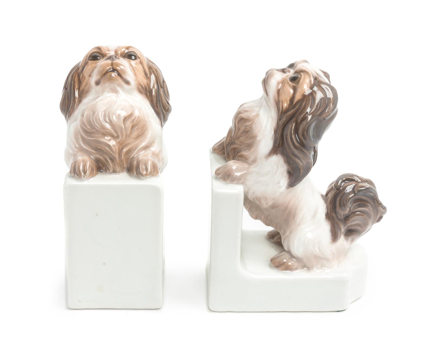 A Pair of Dahl Jensen Porcelain Figural Bookends Height 6 1/2 inches. — 20TH CENTURY