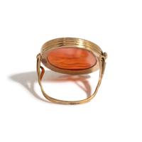 A Neoclassical Gold and Carnelian Finger Ring with the God Zeus, a Reclining Female, and a Greek Inscription
