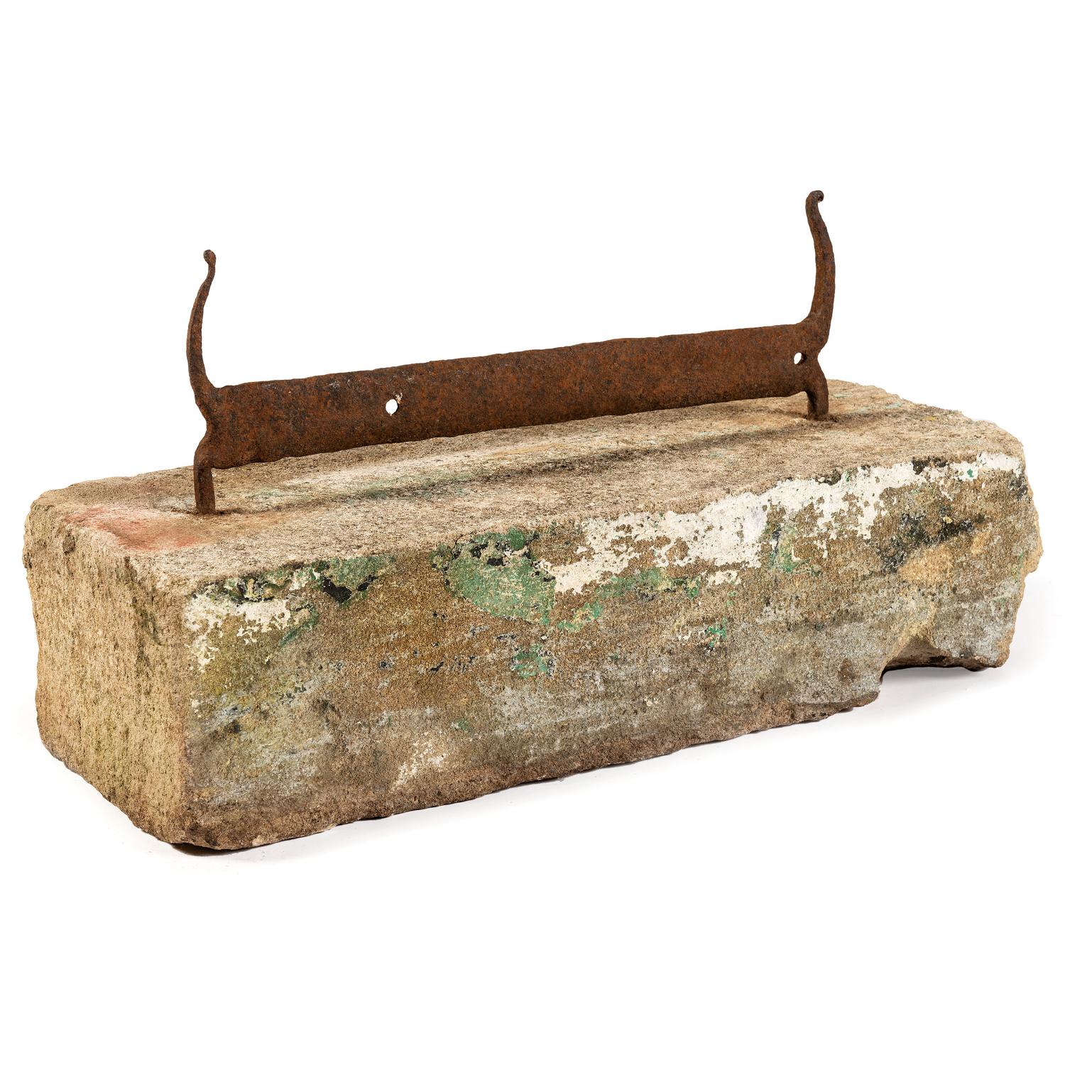 A Wrought Iron Boot Scrape with Stone Base