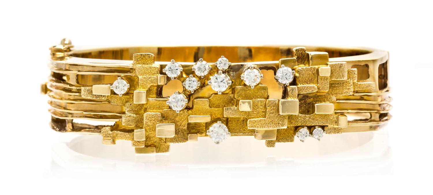 A Modernist 14 Karat Yellow Gold and Diamond Bangle Bracelet, 23.70 dwts.
