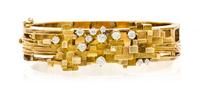 A Modernist 14 Karat Yellow Gold and Diamond Bangle Bracelet, 23.70 dwts.