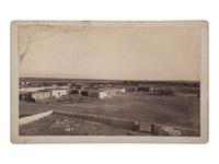 [NEW MEXICO]. A group of 2 photographs, incl. view of Pueblo Of Isleta Looking So’ East and Pueblo Indians gambling. Ca 1880s.