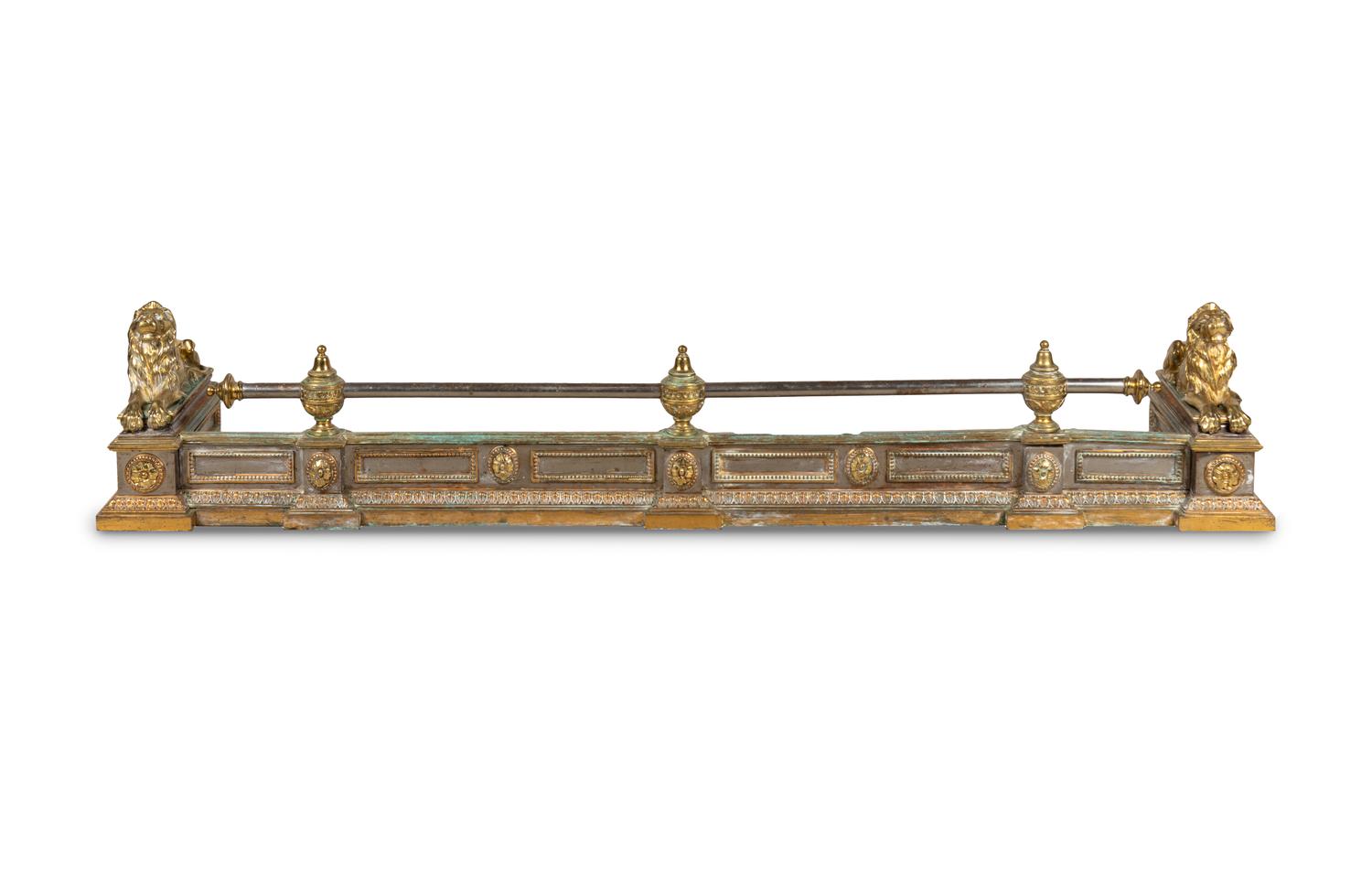 An Empire Style Brass and Steel Fire Fender with Recumbent Lions