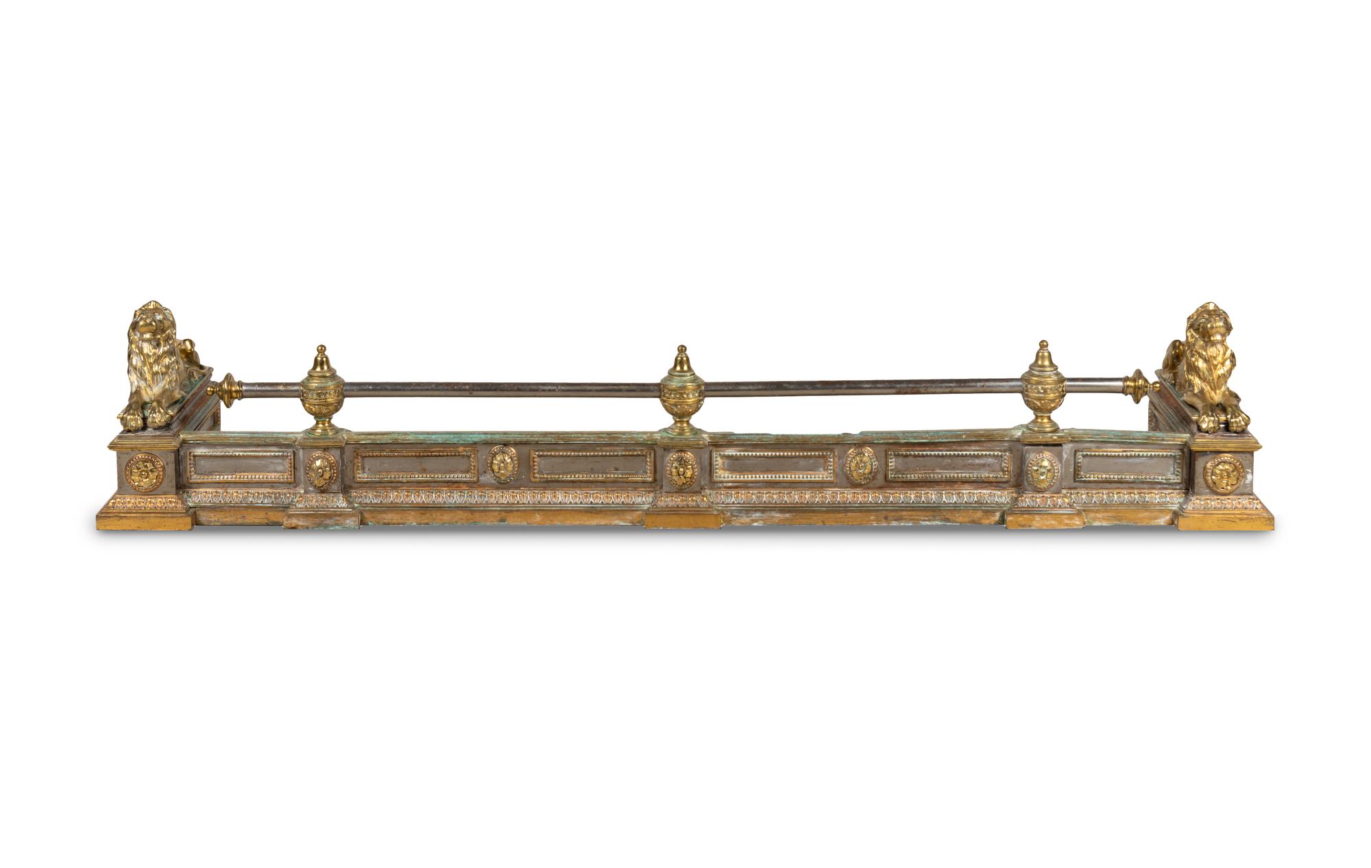 An Empire Style Brass and Steel Fire Fender with Recumbent Lions