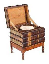 A Louis Philippe Book Spine and Birch Low Storage Table