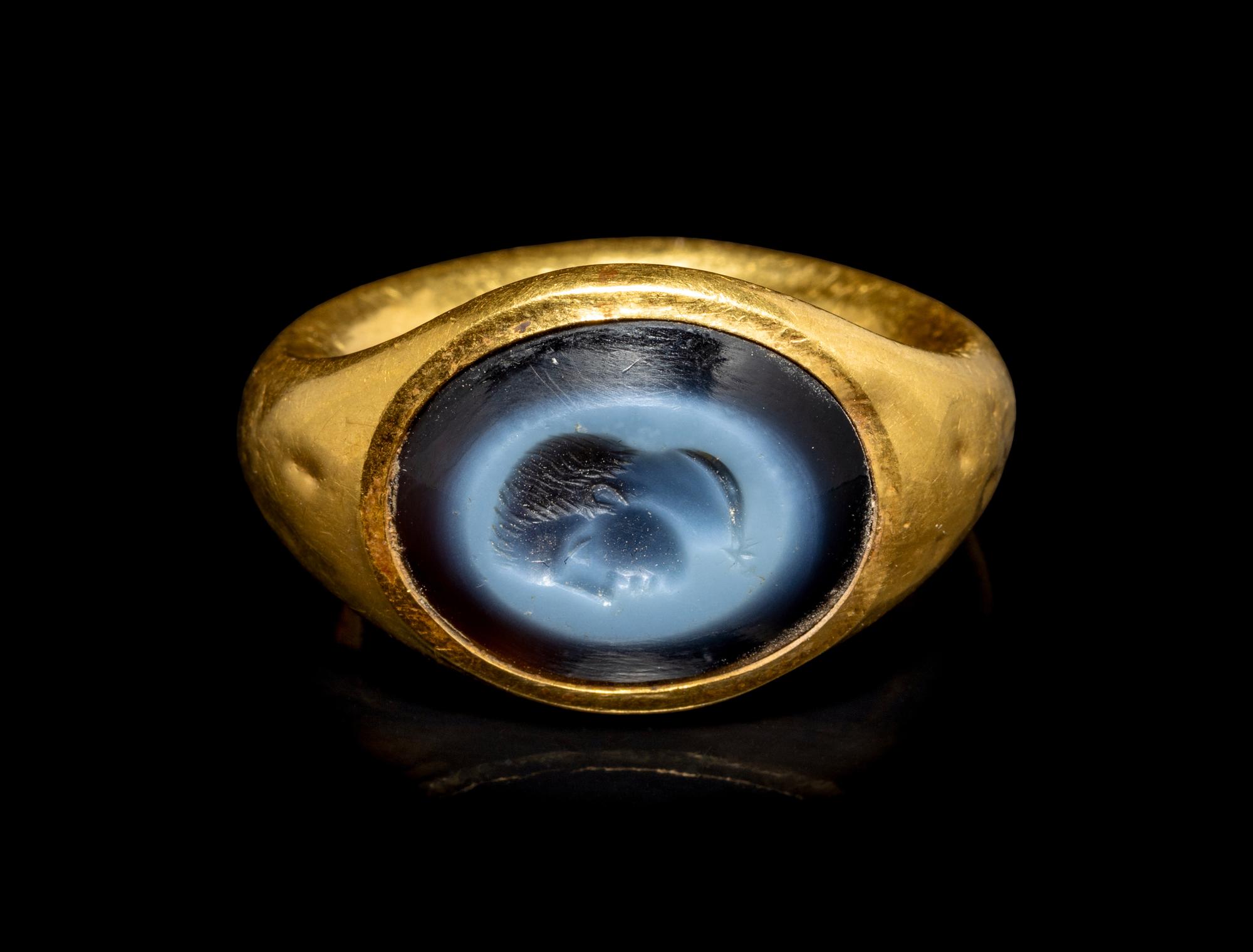 A Roman Gold and Nicolo Finger Ring with a Bust of a Youth