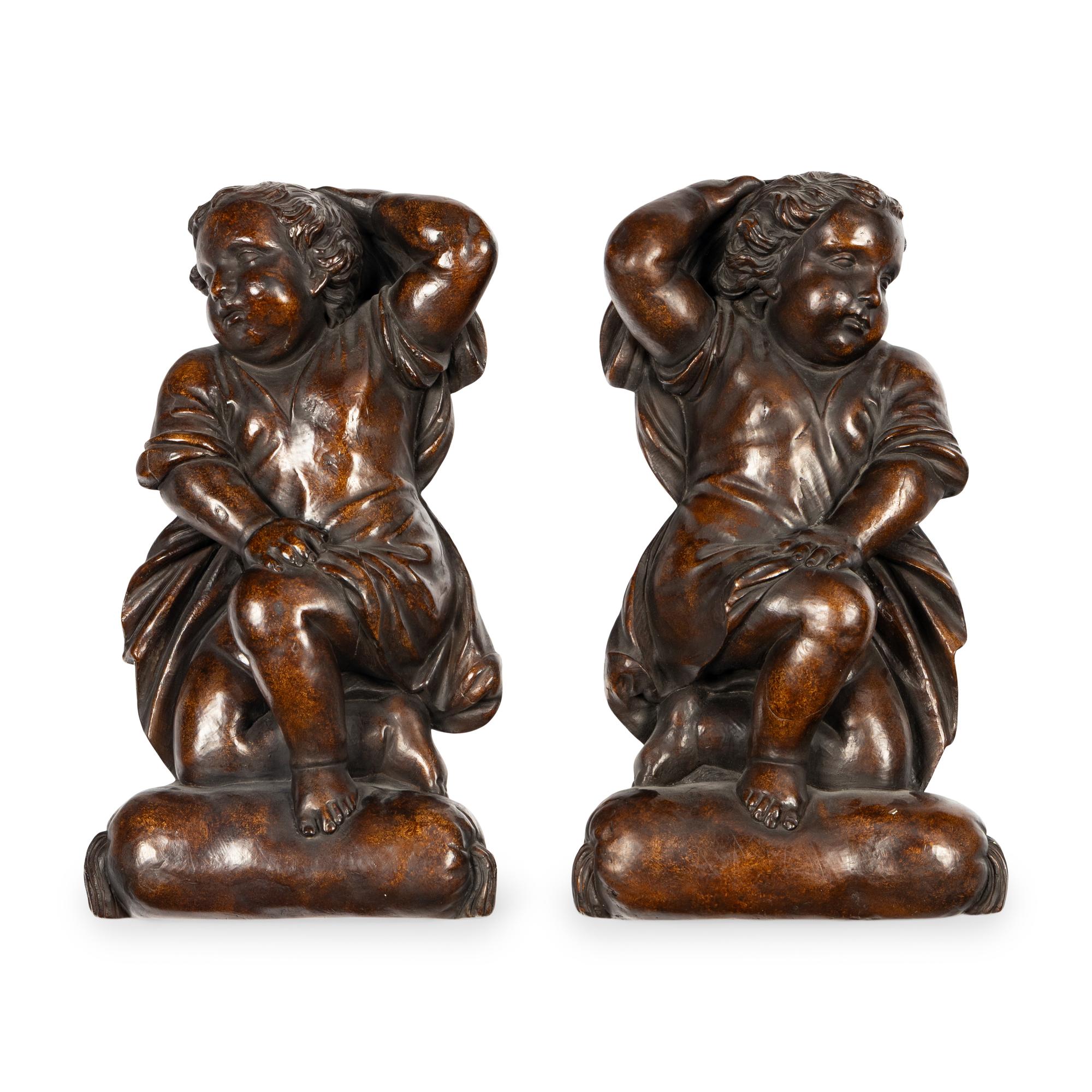 A Pair of Continental Painted Composition Figural Wall Ornaments