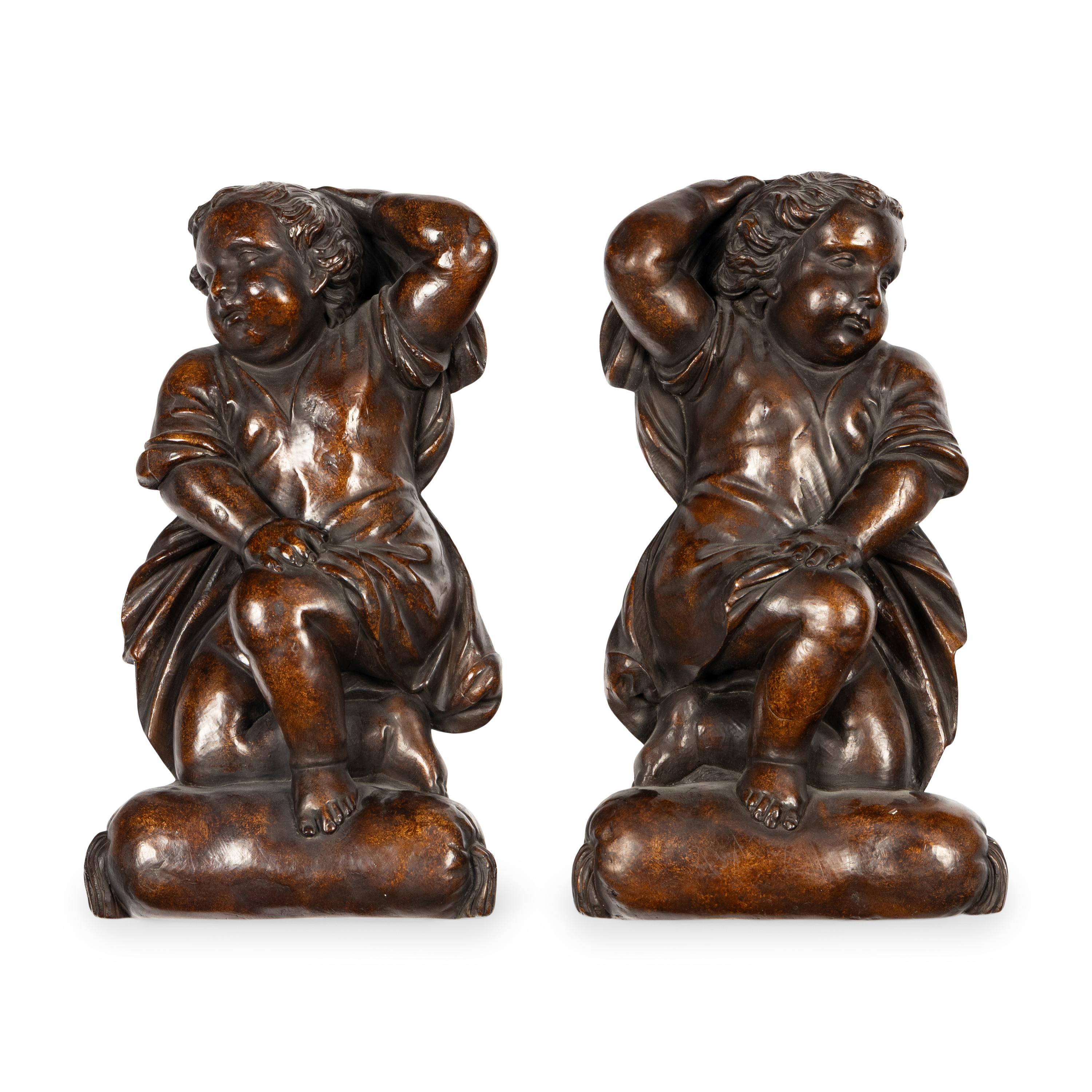 A Pair of Continental Painted Composition Figural Wall Ornaments