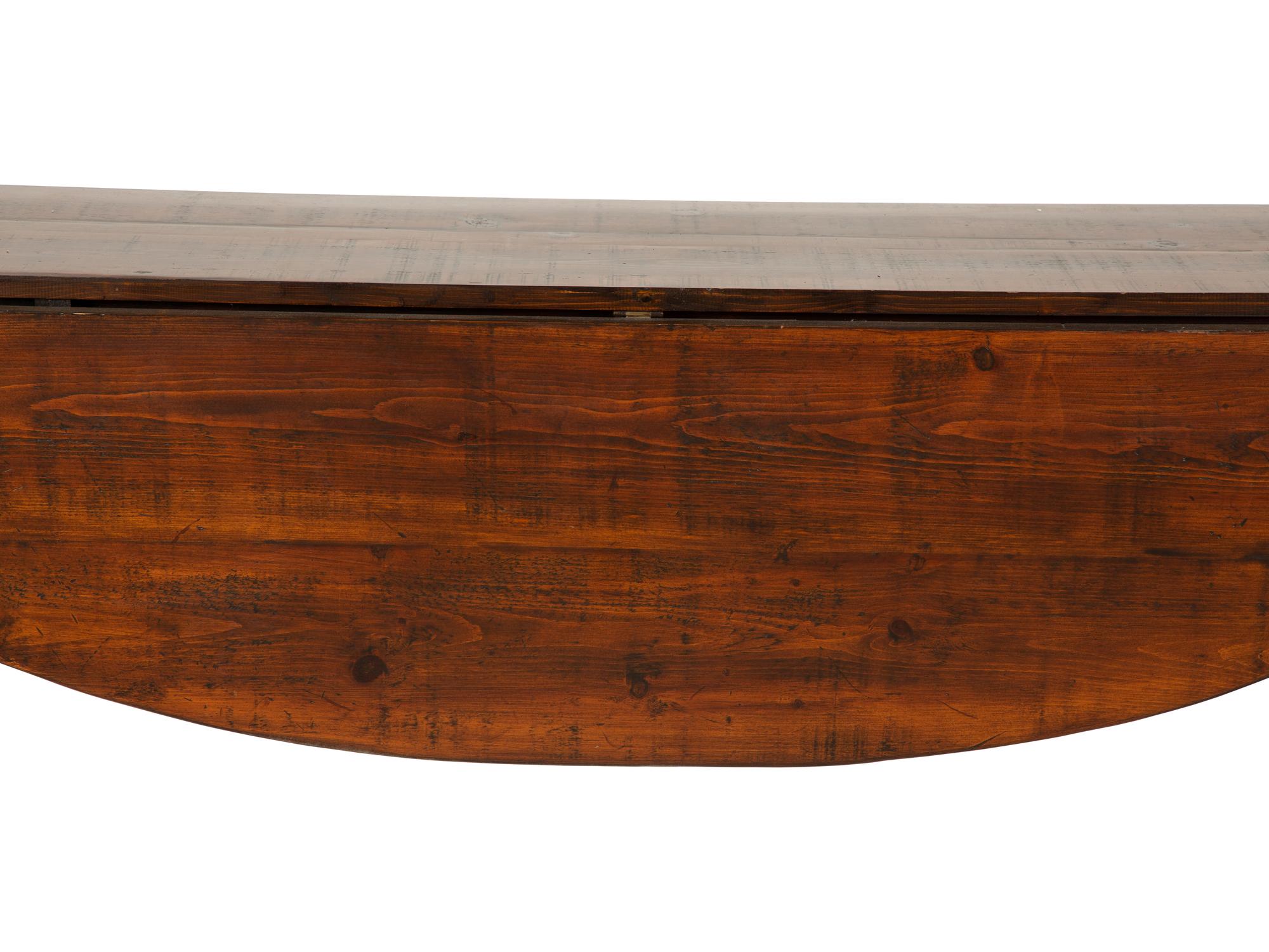 A Queen Anne Style Stained Pine Drop Leaf Gate Leg Dining Table — 20th Century