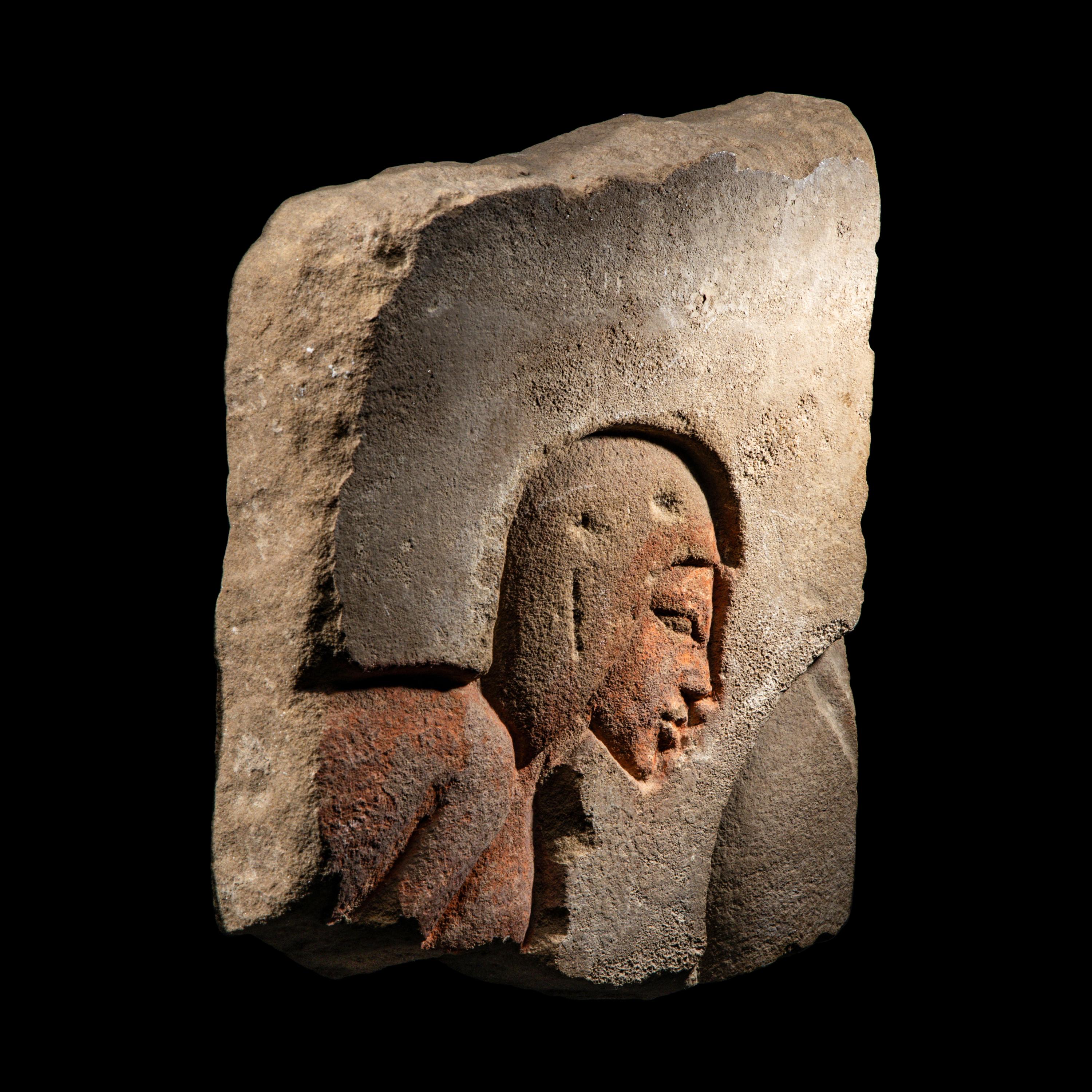 An Egyptian Sandstone Relief Fragment with a Worshipper