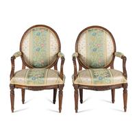 A Pair of Louis XVI Carved Walnut Fauteuils