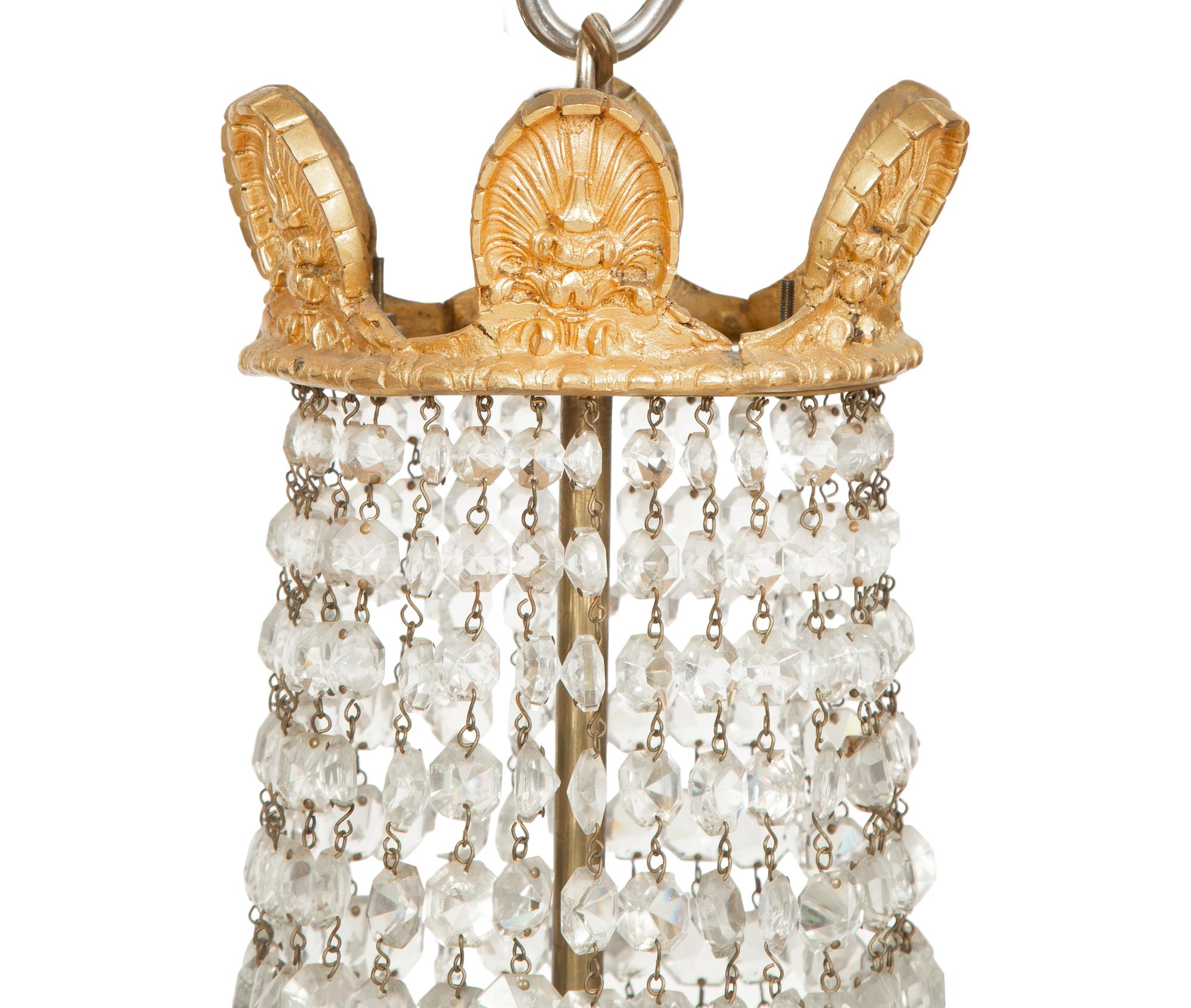 An Empire Style Gilt Metal and Cut Glass Six-Light Chandelier