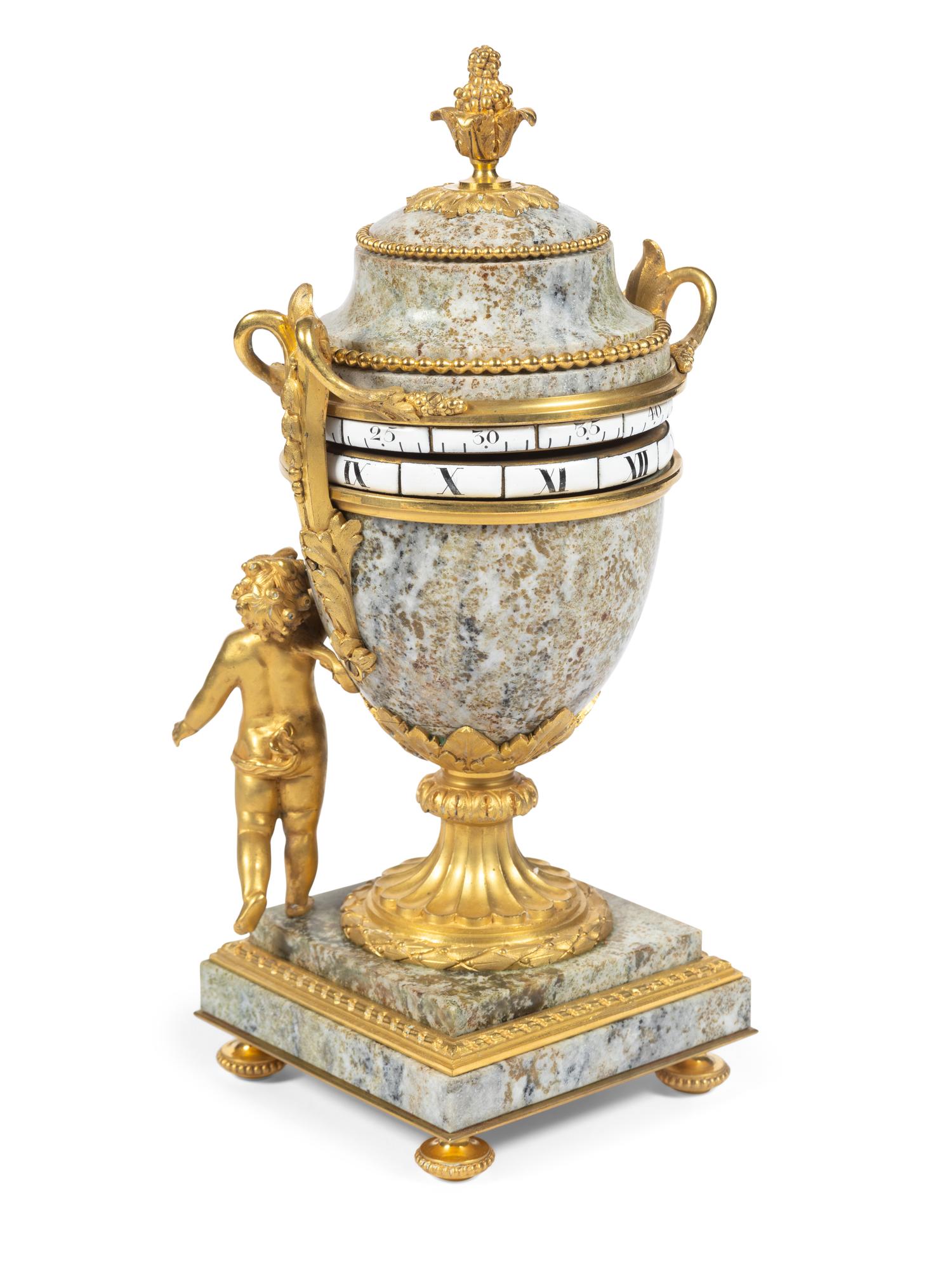 A Louis XVI Style Gilt Bronze and Marble Annular Mantel Clock