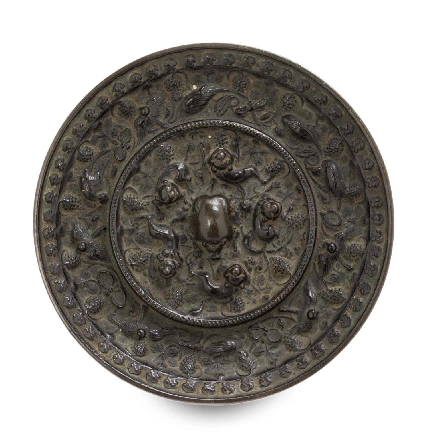A Bronze 'Beast and Grapevine' Mirror Diameter 5 1/2 inches. — TANG DYNASTY (618-907)
