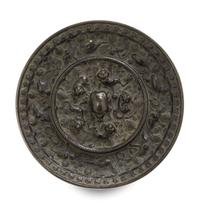 A Bronze 'Beast and Grapevine' Mirror Diameter 5 1/2 inches. — TANG DYNASTY (618-907)