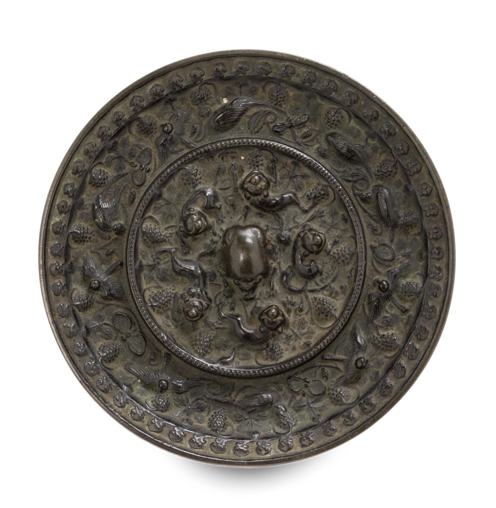 A Bronze 'Beast and Grapevine' Mirror Diameter 5 1/2 inches. — TANG DYNASTY (618-907)