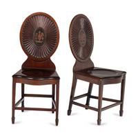 A Pair of Regency Style Mahogany and Polychrome Decorated Hall Chairs