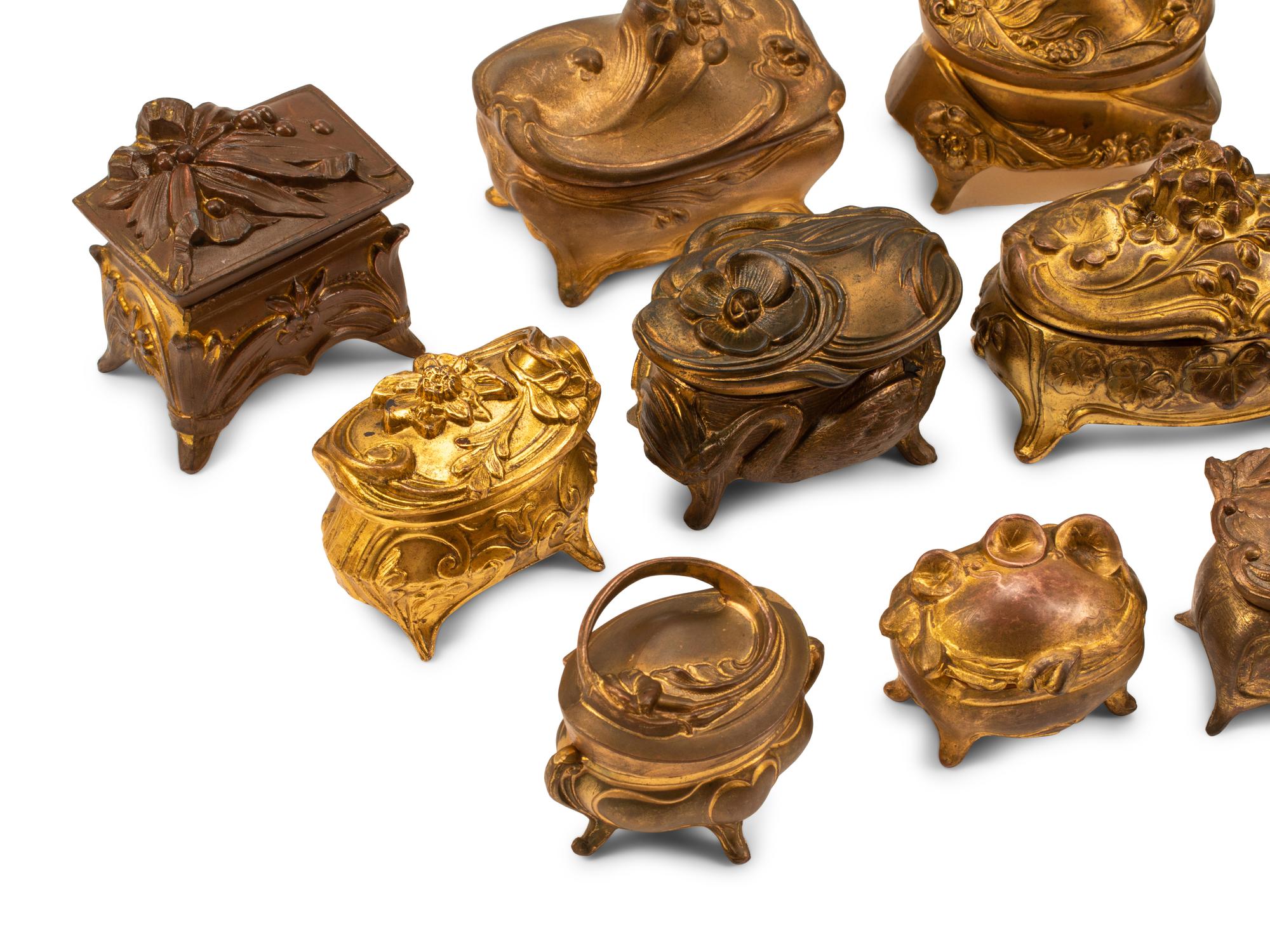 A Collection of Sixteen French Bronze and Metal Small Boxes
