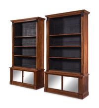 A Pair of Italian Parcel Ebonized Walnut Bookcases