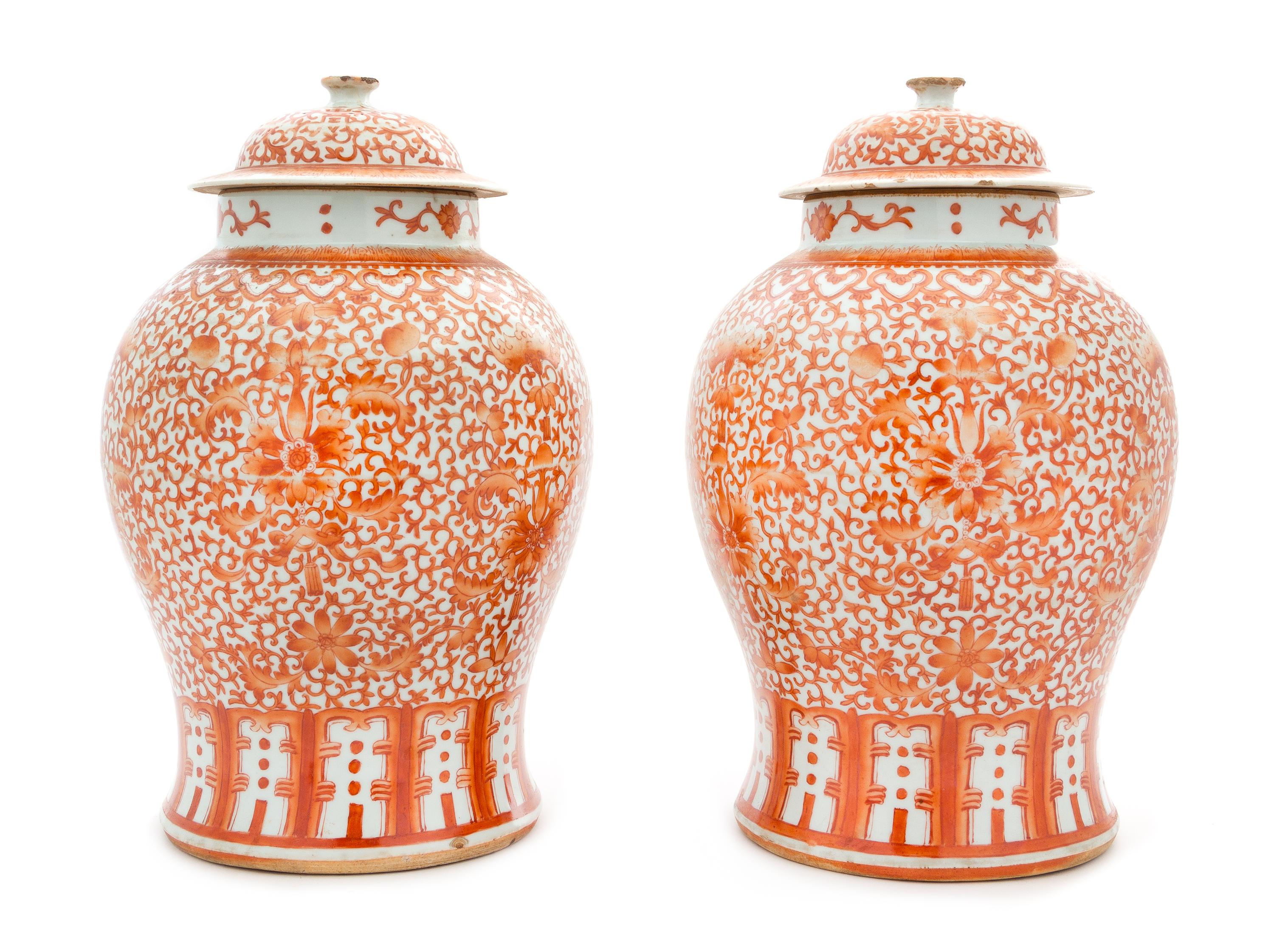 A Large Pair of Iron Red Decorated Porcelain Baluster Jars and Covers Height of each 15 1/2 inches. — 19TH CENTURY