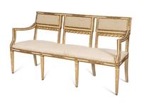 An Italian Louis XVI Style Cream Painted and Parcel Gilt Parlor Suite