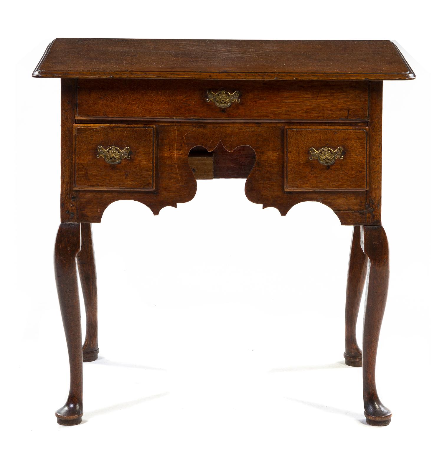 A George III Oak Lowboy, Height 27 1/2 x width 29 1/2 x depth 17 3/4 inches.