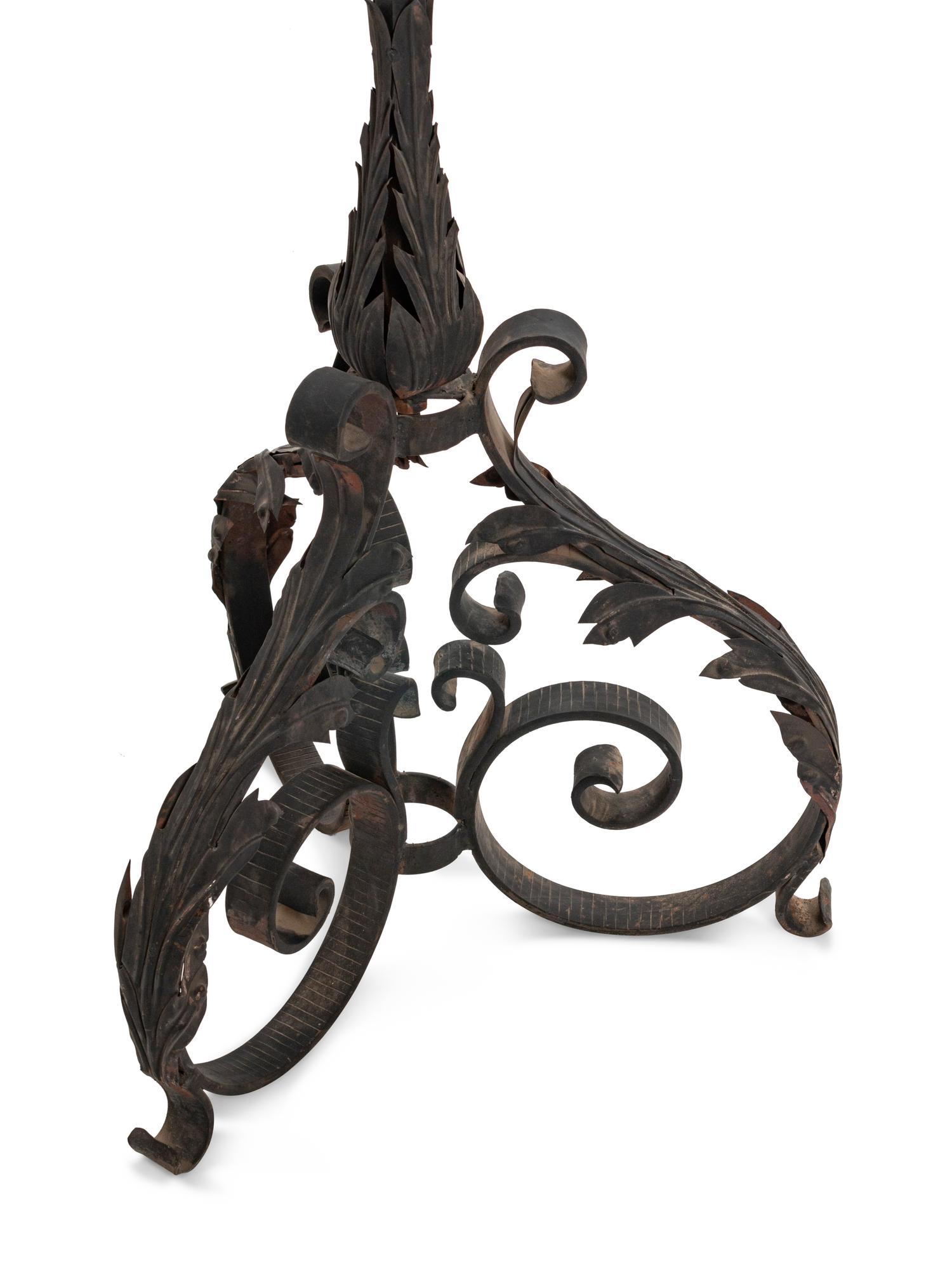A Pair of Spanish Baroque Style Wrought-Iron and Tole Floor Standing Torcheres