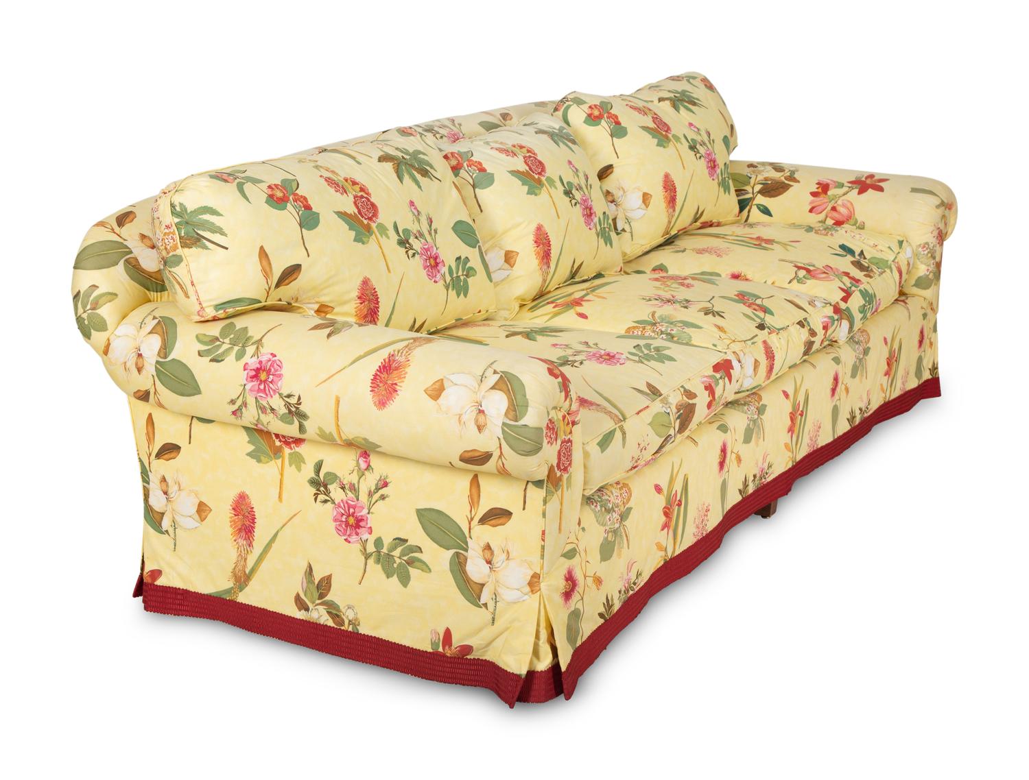 A Yellow Floral Chintz Upholstered Sofa and a Pair of Matching Drapes