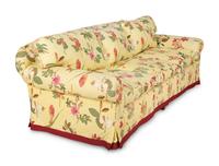 A Yellow Floral Chintz Upholstered Sofa and a Pair of Matching Drapes