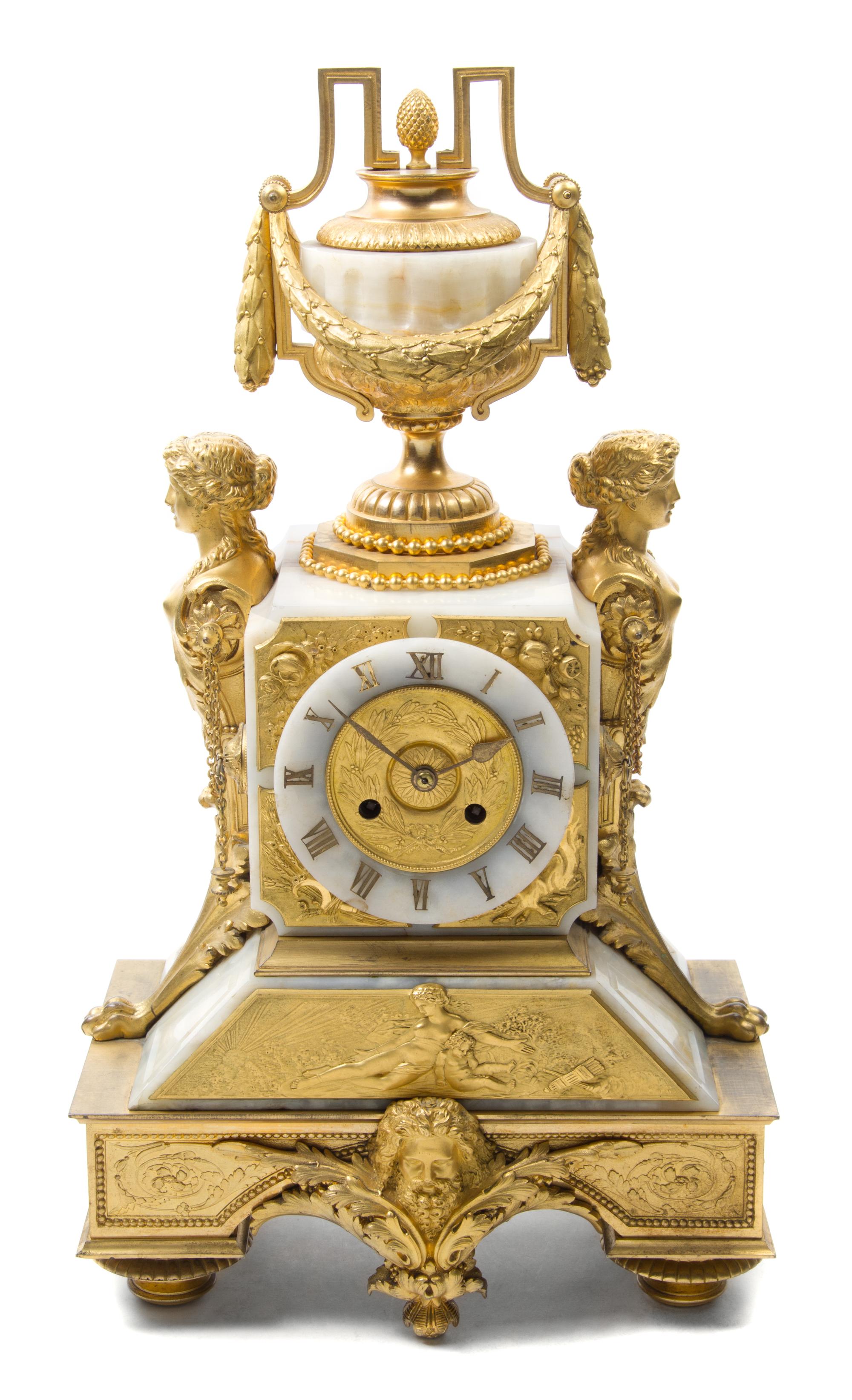 A Louis XVI Style Gilt Bronze and Onyx Mantel Clock Height 20 1/2 inches. — 19TH CENTURY