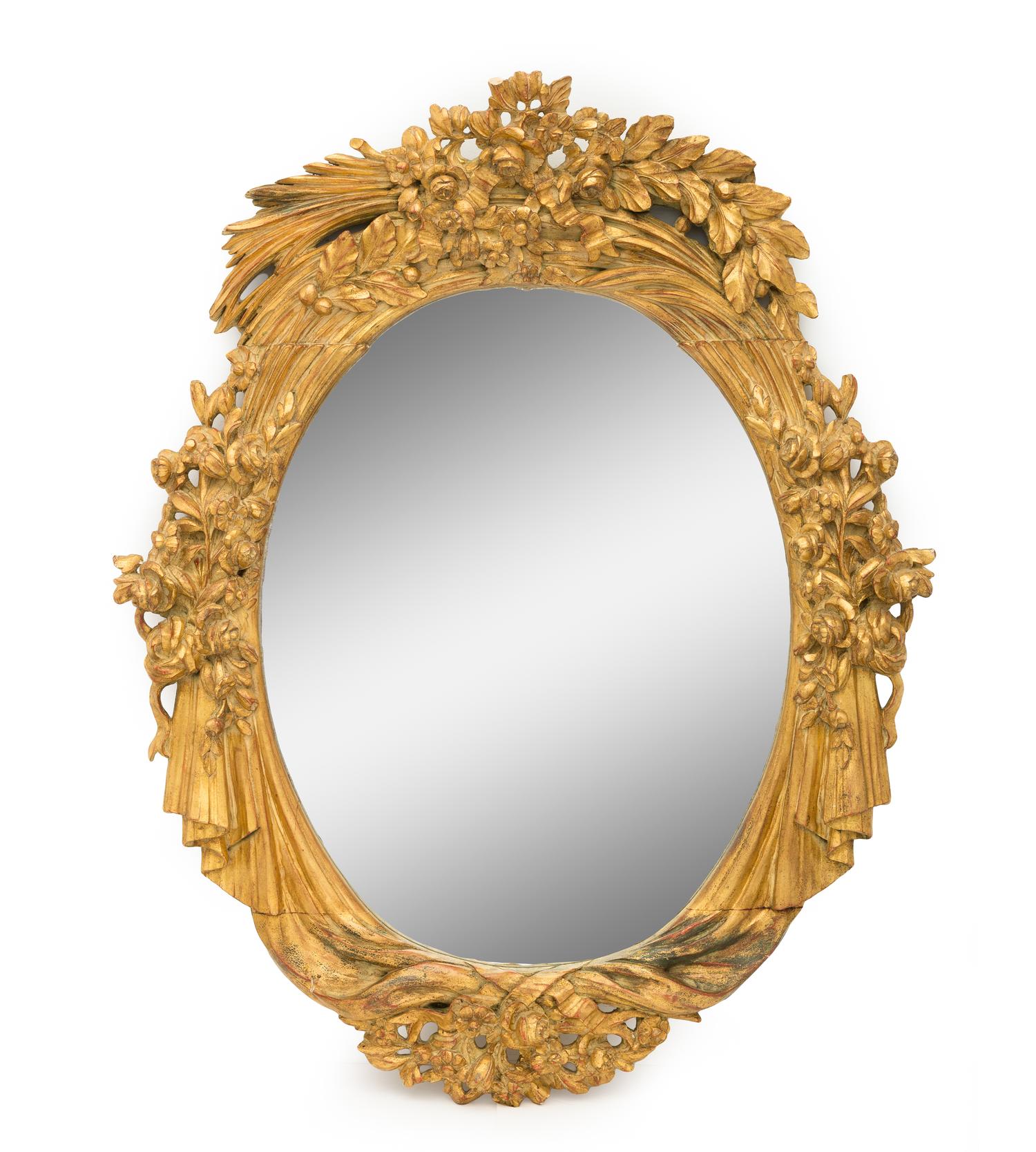 A Large Continental Giltwood Oval Mirror