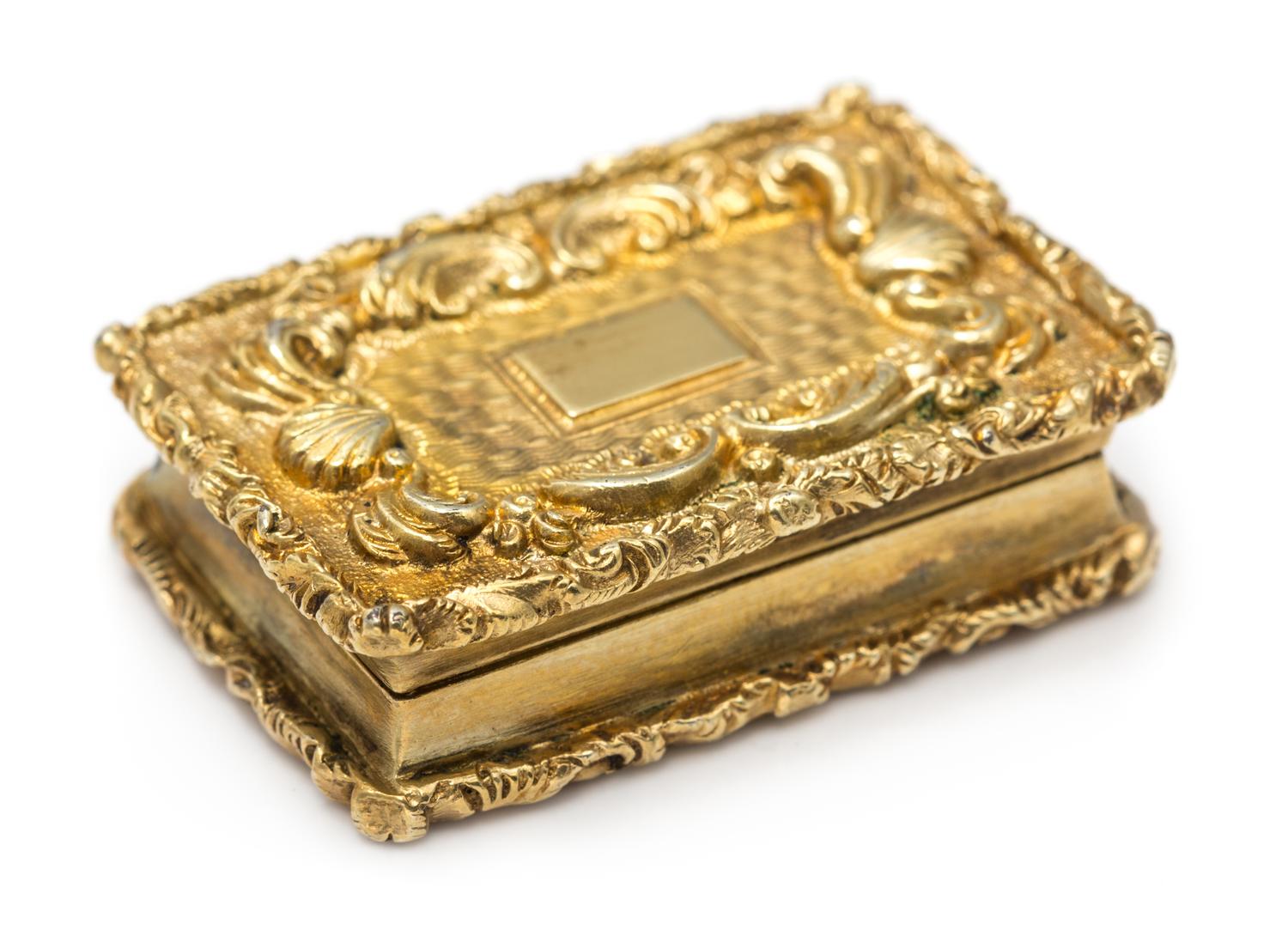A William IV Silver-Gilt Vinaigrette, Maker's Mark E (pellet) J, Birmingham, the lid decorated with rocaille and C-scroll motifs center