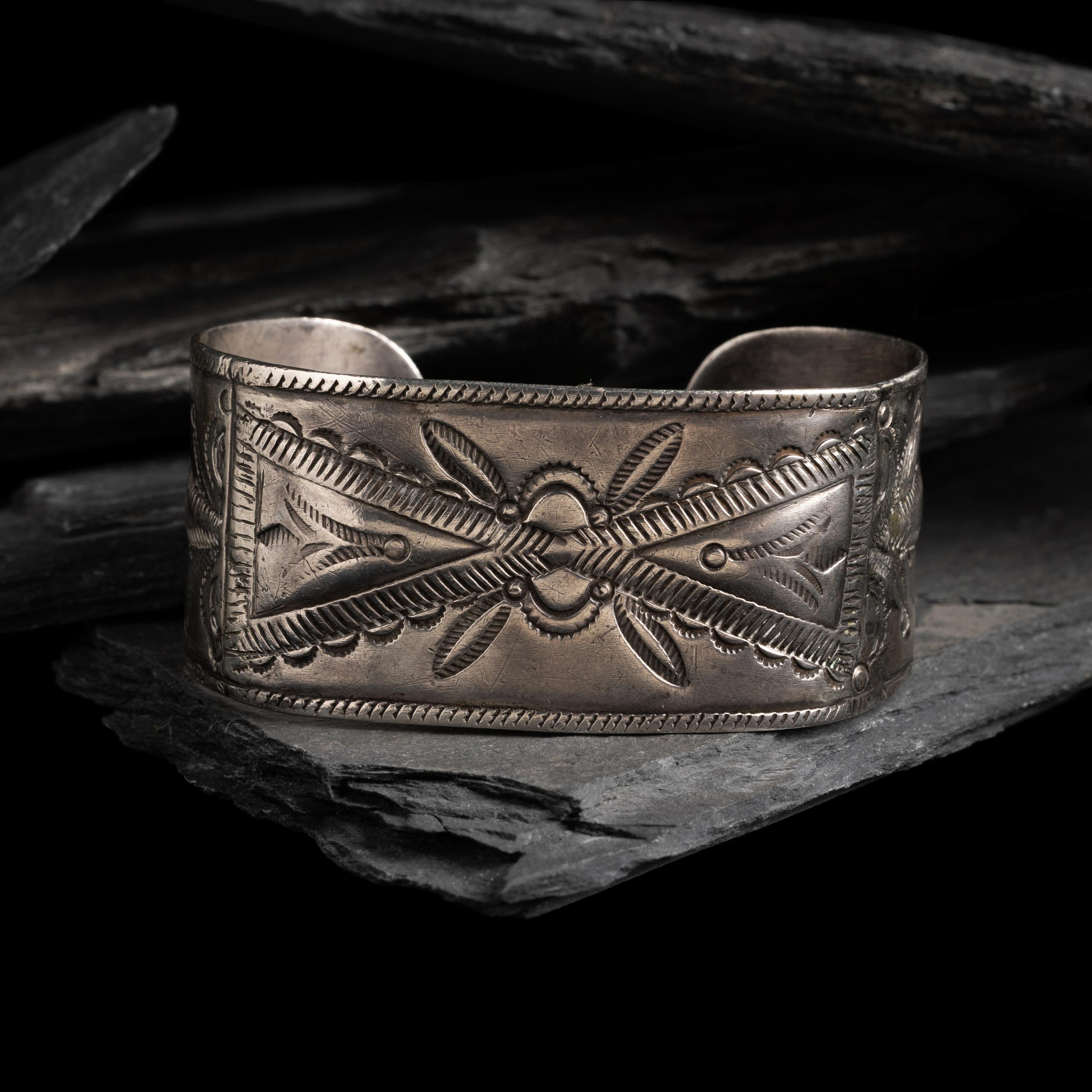 Early Navajo Heavily Stamped and Chiseled Ingot Cuff Bracelet, with Repoussé Elements