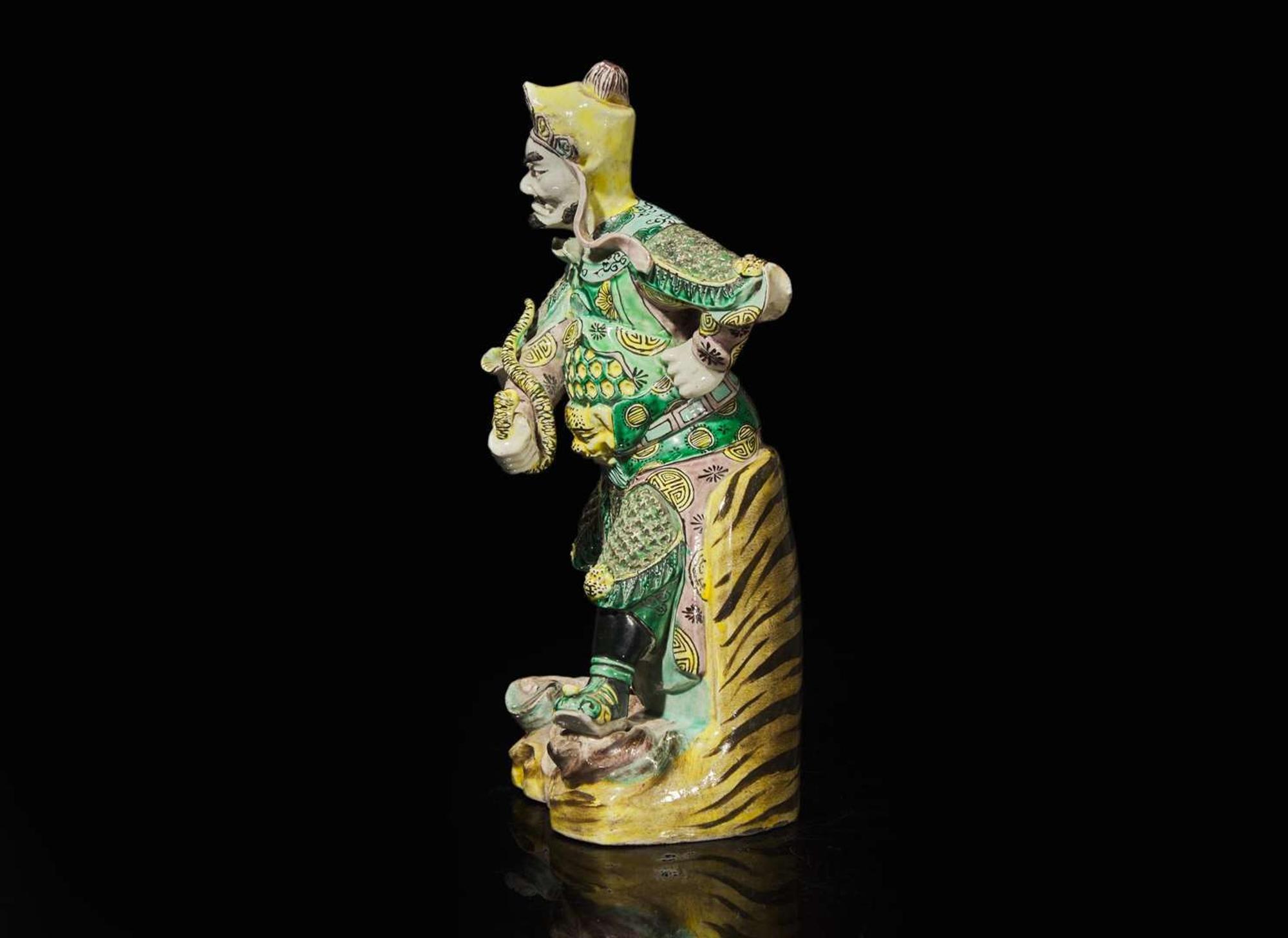 A Chinese famille verte figure of Guangmu Tianwang, guardian king of the West 素三彩造像一尊