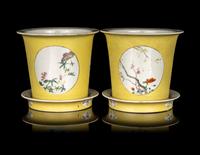 A Pair of Chinese Yellow Ground Famille Rose Cache Pots and Undertrays