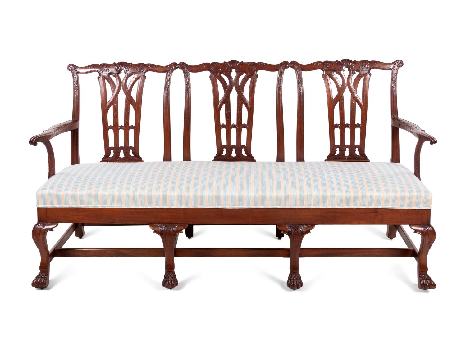 A George III Style Carved Mahogany Triple-Back Settee