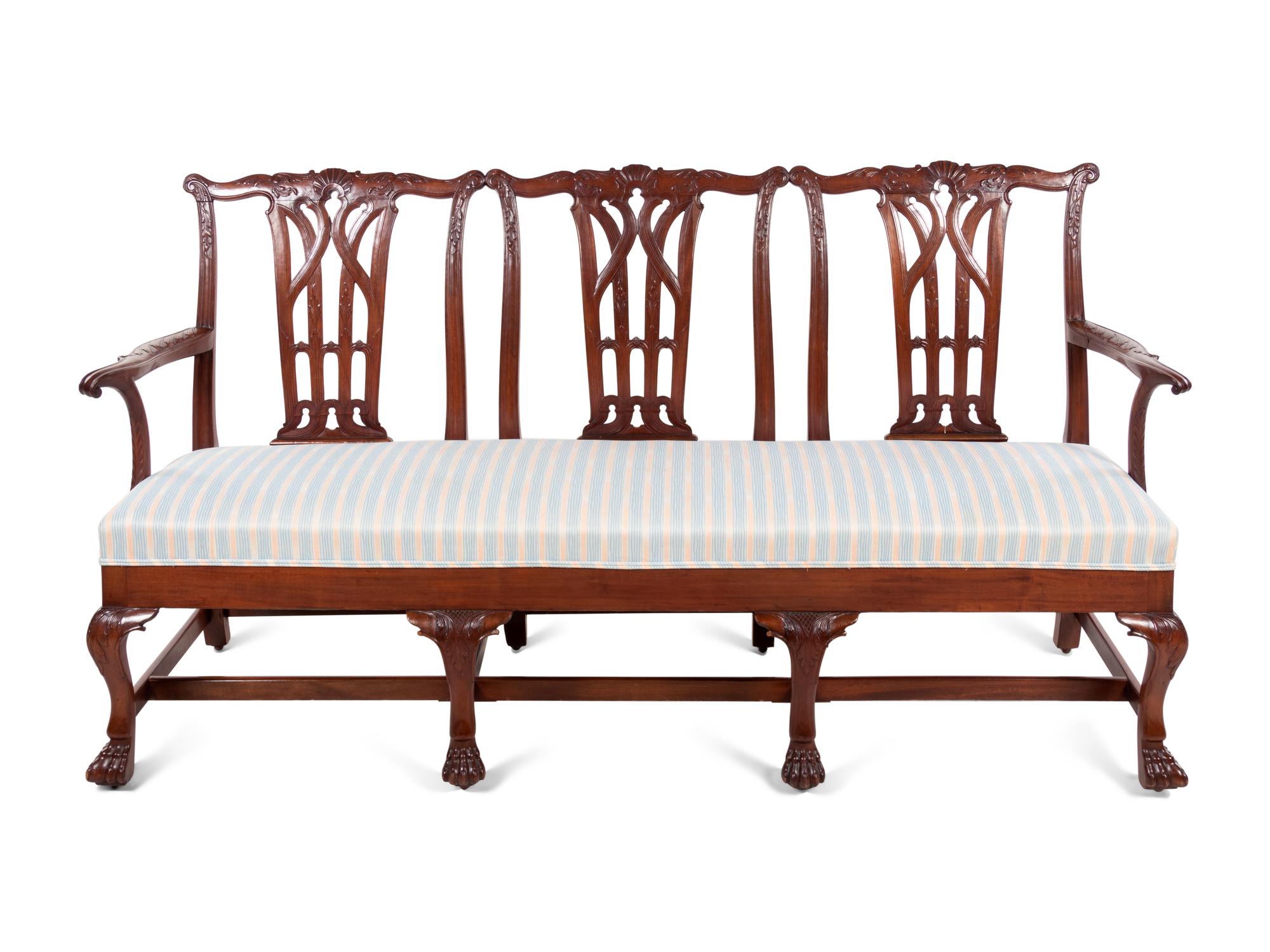 A George III Style Carved Mahogany Triple-Back Settee