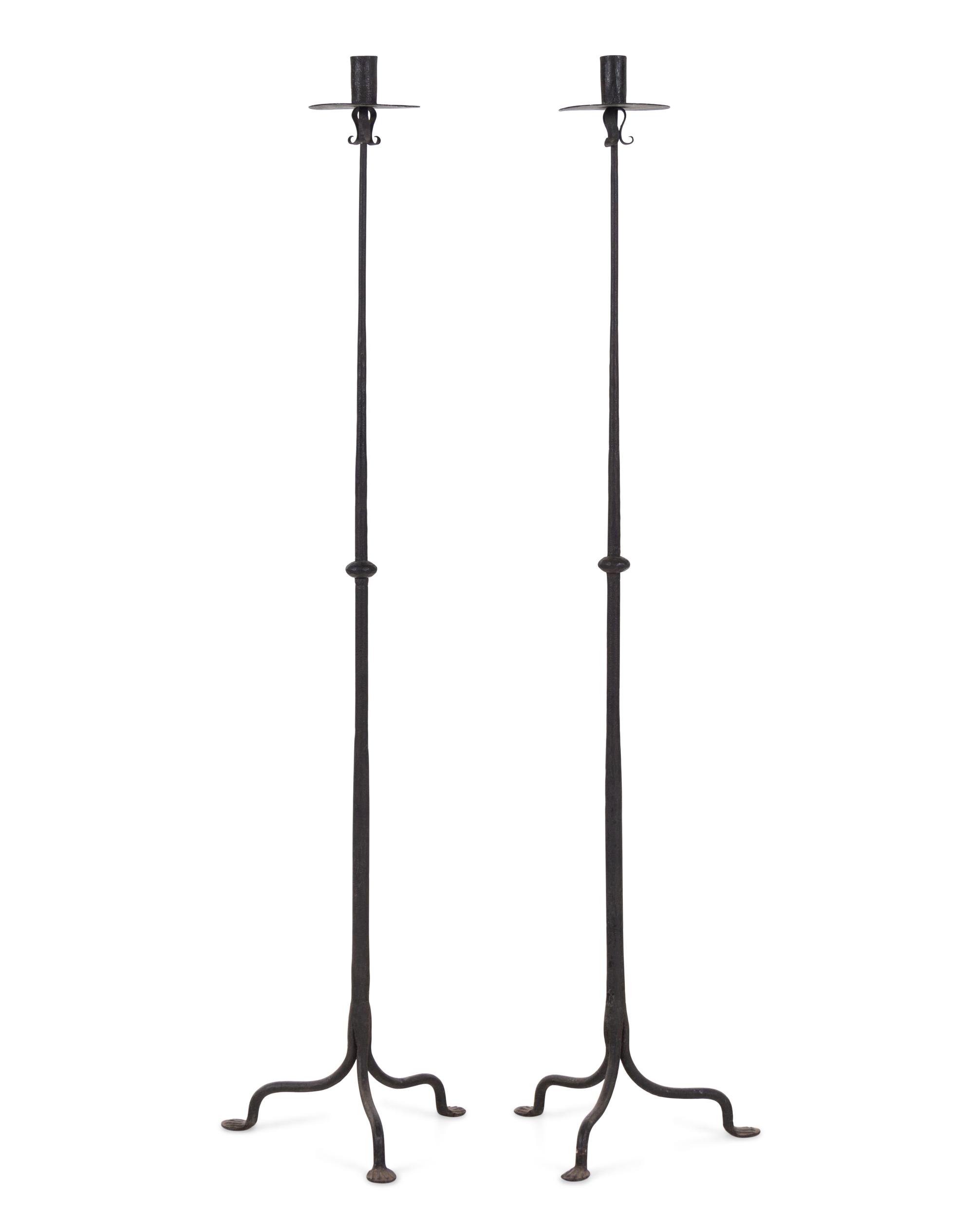 A Pair of Spanish Wrought Iron Floor Candlesticks