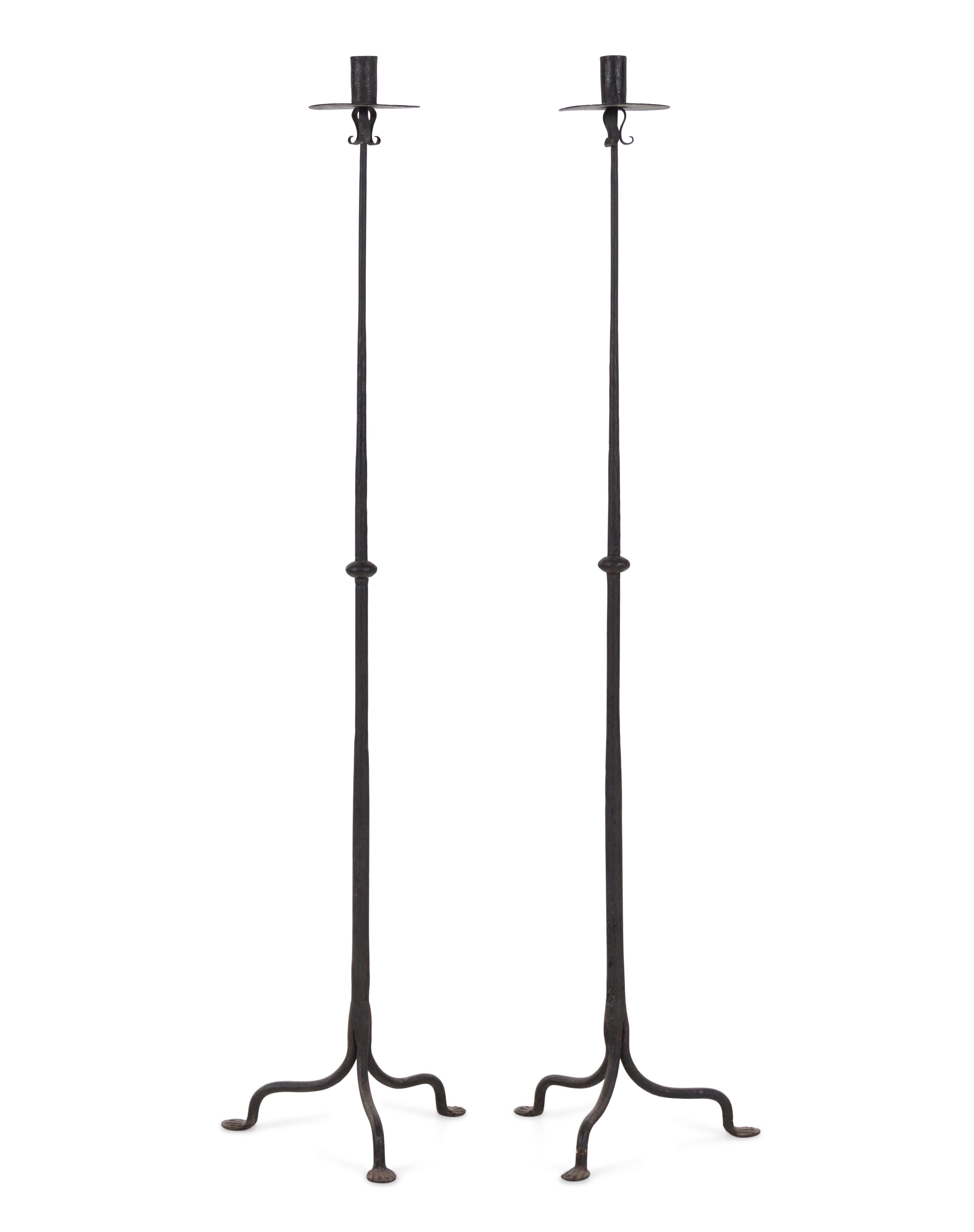 A Pair of Spanish Wrought Iron Floor Candlesticks