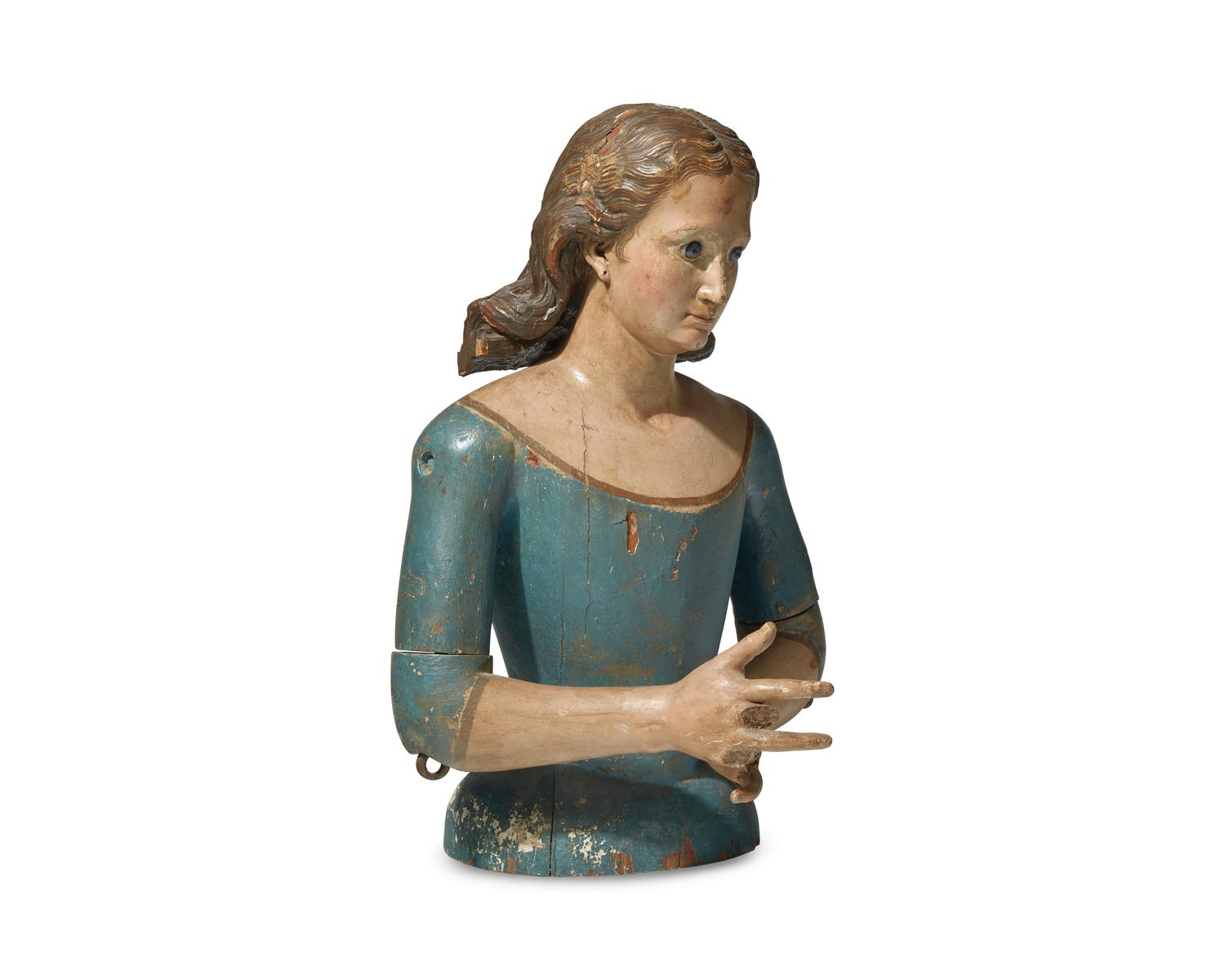 A Carved and Painted Mannequin of a Young Woman