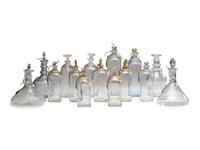 Fifteen Glass Decanters with English Shell-Form Silver Bottle Tags