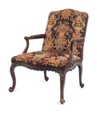 A George II Style Carved Mahogany Armchair with Needlepoint Upholstery