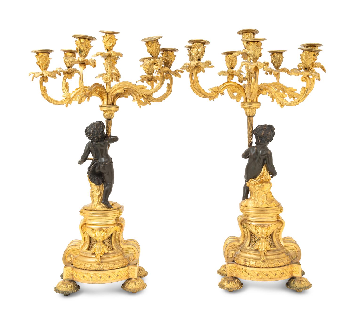 A Pair of French Gilt and Patinated Bronze Figural Seven-Light Candelabra