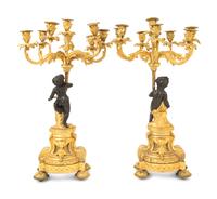 A Pair of French Gilt and Patinated Bronze Figural Seven-Light Candelabra