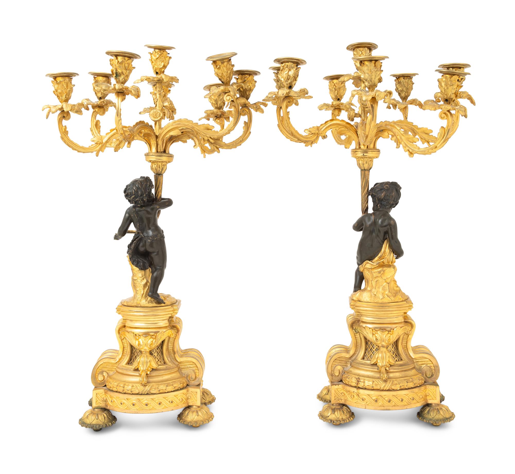 A Pair of French Gilt and Patinated Bronze Figural Seven-Light Candelabra