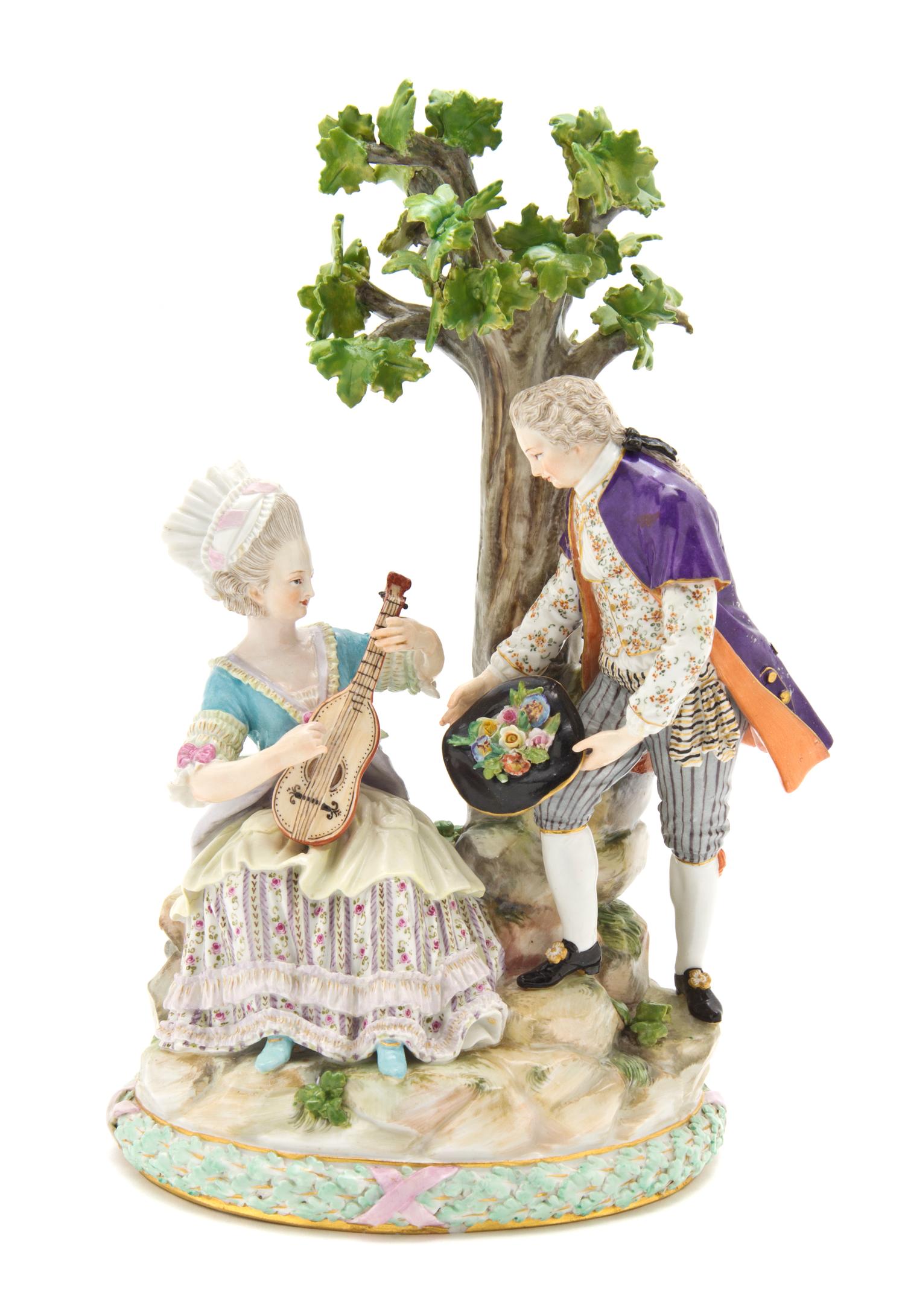 A Meissen Porcelain Figural Group, Height 10 inches.