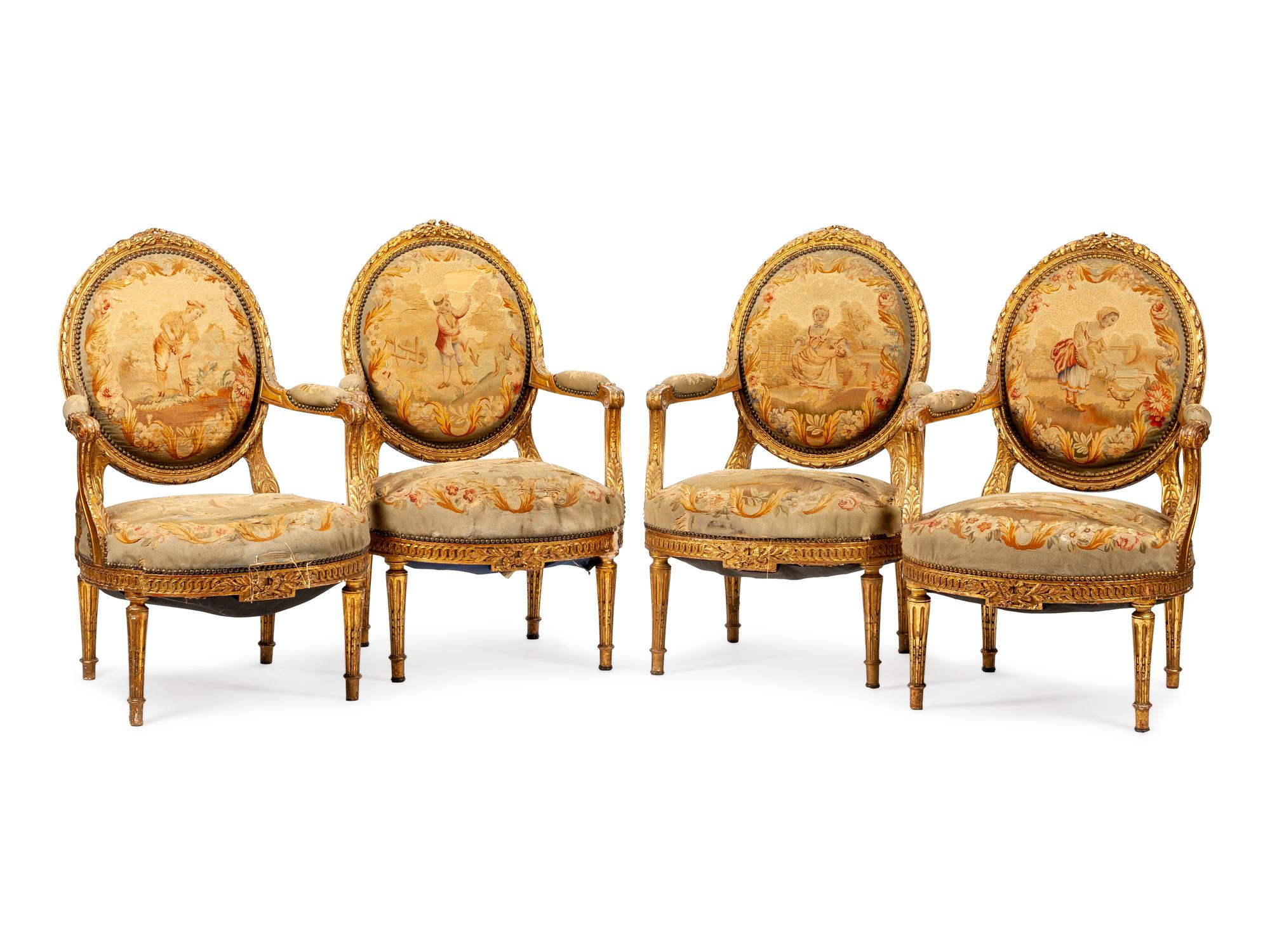 A Set of Four Louis XVI Style Aubusson Tapestry Upholstered Giltwood Fauteuils — CIRCA 1900